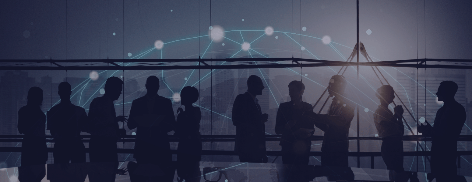 Blurred image of professionals at a global conference event.